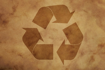 Brown paper background with recycling logo sign