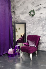 Purple armchair and christmas gifts, winter holiday concept