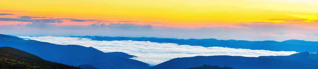 Fototapeta na wymiar Sunrise on the top of Carpathian mountains over the clouds, awesome nature landscape in early morning