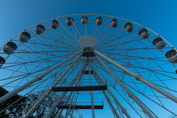 Fototapeta premium Biggest Ferris wheel in Brno, Czech Republic in Moravske square during set up for Christmas event captured at night time