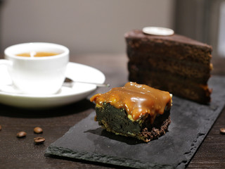 Cup of coffe with cake and beans