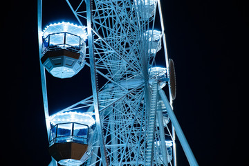 Biggest Ferris wheel in Brno, Czech Republic in Moravske square during set up for Christmas event captured at night time