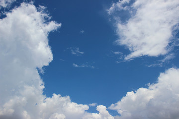 Puffy clouds on deep blue sky