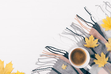 Top view cup of coffee among cozy flat lay  composition