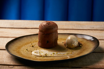 Chocolate Fondant cake and pistachio ice cream with English crea