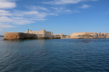 Fototapeta na wymiar View from Mediterranean Sea to Castello Maniace in Ortigia Syracuse, Sicily Italy