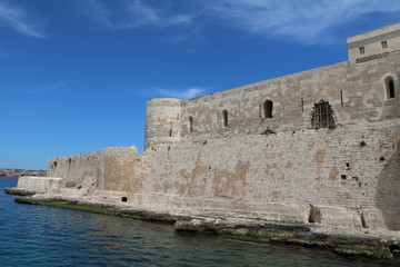 View from Mediterranean Sea to Castello Maniace in Ortigia Syracuse, Sicily Italy