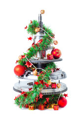 Abstract christmas tree of car parts on a white background. Decorated with Christmas toys, garland