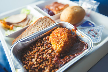 View of food for the passengers in the air plane, lunch for airline passengers, russian dinner meal menu at airplane