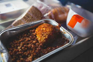 View of food for the passengers in the air plane, lunch for airline passengers, russian dinner meal menu at airplane