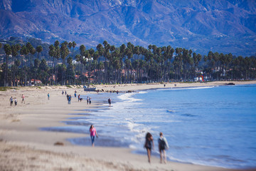 Beautiful view of Santa Barbara ocean front walk, with beach and marina, palms and mountains, Santa Ynez mountains and Pacific Ocean, Santa Barbara county, California, United States, summer sunny day