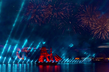Obraz na płótnie Canvas Swedish brig Tre Krunur on the annual celebration school graduates Scarlet Sails in St. Petersburg. Festive fireworks and light show over the Neva river.