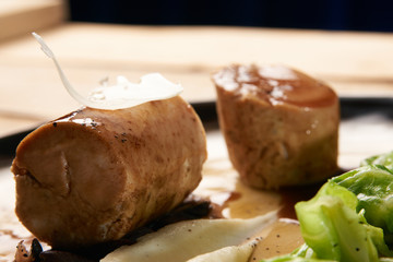 Baked chicken sausage meat with baked green cabbage.