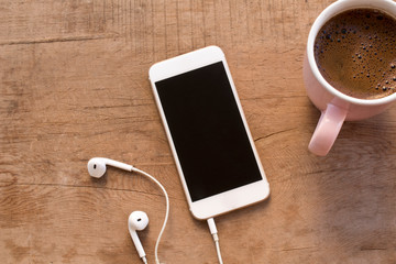 Mobile phone on wooden table
