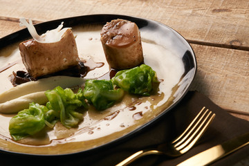 Bavarian chicken sausage meat with baked green cabbage