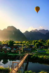 Hot air balloon flying in Vang Vieng, Vientiane Province, Laos - obrazy, fototapety, plakaty