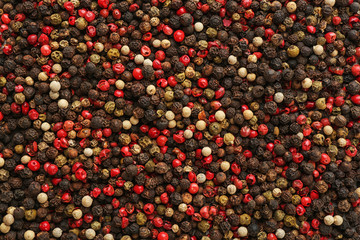Different types of pepper as background. Natural spice