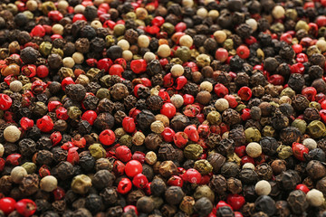 Different types of pepper as background. Natural spice