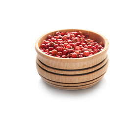 Bowl with red peppercorns on white background