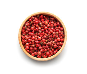 Bowl with red peppercorns on white background, top view
