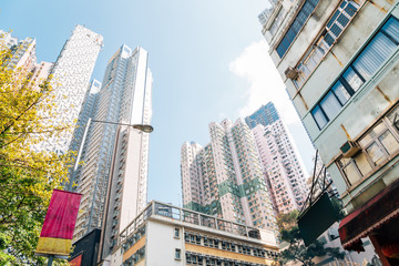 Modern apartment and old buildings low angle view in Soho, Hong Kong - obrazy, fototapety, plakaty