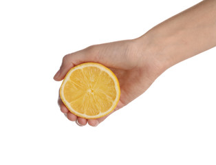 Woman holding fresh juicy half lemon isolated on white, closeup