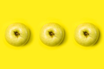 apple from above perspective on yellow background