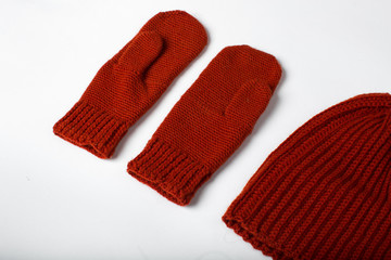 knitted hat with gloves red on a white background