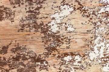 Brown and white rough peeled  and stripped paint on wood grain