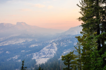 Sunrise landscape in Yosemite National Park; low visibility due to the smoke from the Ferguson Fire present in the air; California