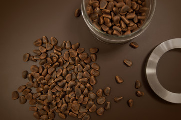 Crude pine nuts on brown background top view. Organic and healthy food.