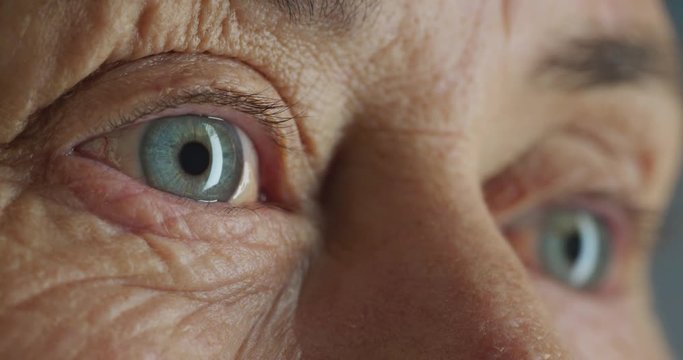 macro beauty blue eyes old woman close up wrinkles optometry concept