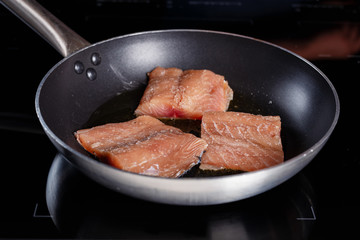 Fish fillet in a frying pan