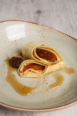 European pancakes, crepes, with plum jam