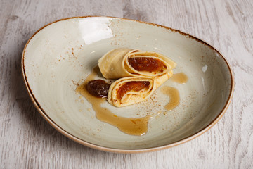 European pancakes, crepes, with plum jam