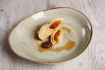 European pancakes, crepes, with plum jam
