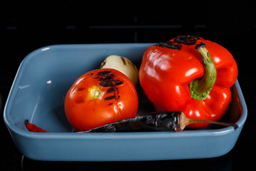 Grilled vegetables, ready to be pealed