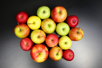 fresh different apples on dark background
