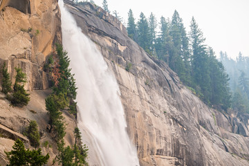 The top of Nevada Falls; smoke from the Ferguson Fire covering the sky, Yosemite National Park, California