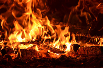 hot flaming wood in the hearth close-up-background image