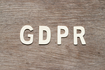 Alphabet letter in word (General Data Protection Regulation) on wood background