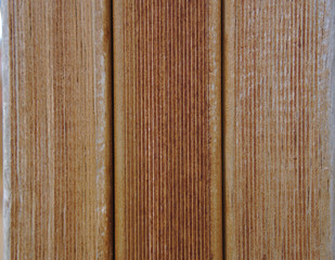 Brown wooden wall with vertical line texture