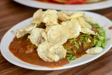 Gado Gado Indonesian salad with peanut sauce on the table.