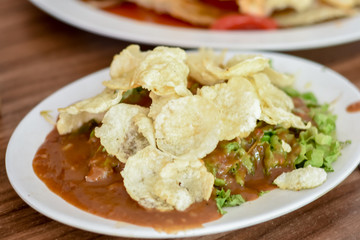 Gado Gado Indonesian salad with peanut sauce on the table.