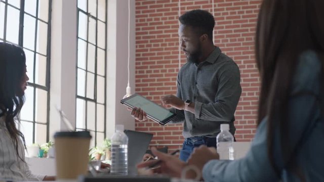 happy business people meeting celebrating success african american team leader businessman dancing funny enjoying celebration colleagues high five sharing corporate victory in office presentation