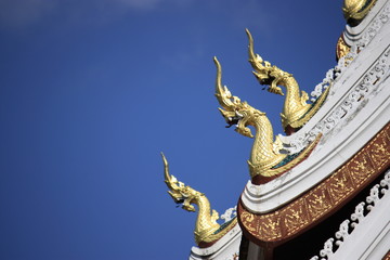 Naga decoration at the roof of temple in Laos