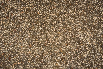 brown and white stone in cement on texture and background