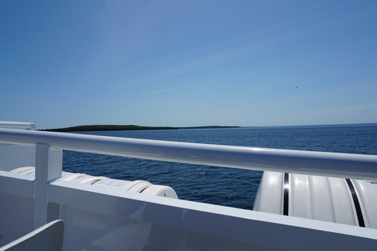 View From Side Of Boat With Lake And Horizon In Background