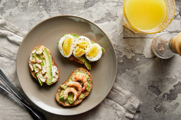 Overhead view of avocado toasts. Plant-based food