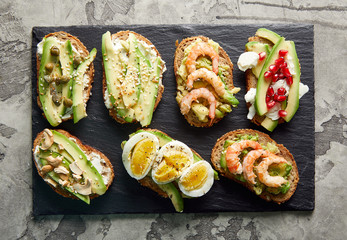 Overhead view of avocado toasts. Plant-based food